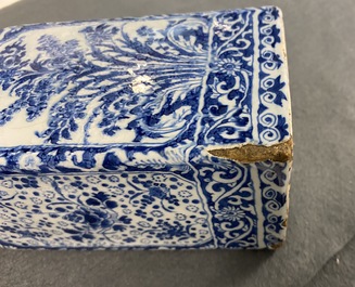 A rectangular Dutch Delft blue and white tea caddy with floral design, late 17th C.